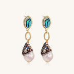 Gold-plated statement earrings with iridescent abalone shells, rope chain links, and crystal-capped baroque pearls