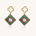 Gold quatrefoil stud earrings with ornate square pendants featuring turquoise stones and freshwater pearls