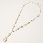 Y-shaped gold-plated necklace with freshwater pearls and geometric elements, featuring a baroque pearl pendant drop
