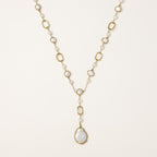 Y-shaped gold-plated necklace with freshwater pearls and geometric elements, featuring a baroque pearl pendant drop
