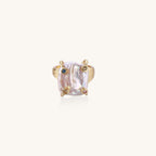 Gold-plated ring featuring large baroque freshwater pearl with small colorful gemstone accents on textured band