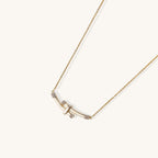 Elegant 14K gold plated necklace featuring two curved bars with diamond accents on adjustable chain