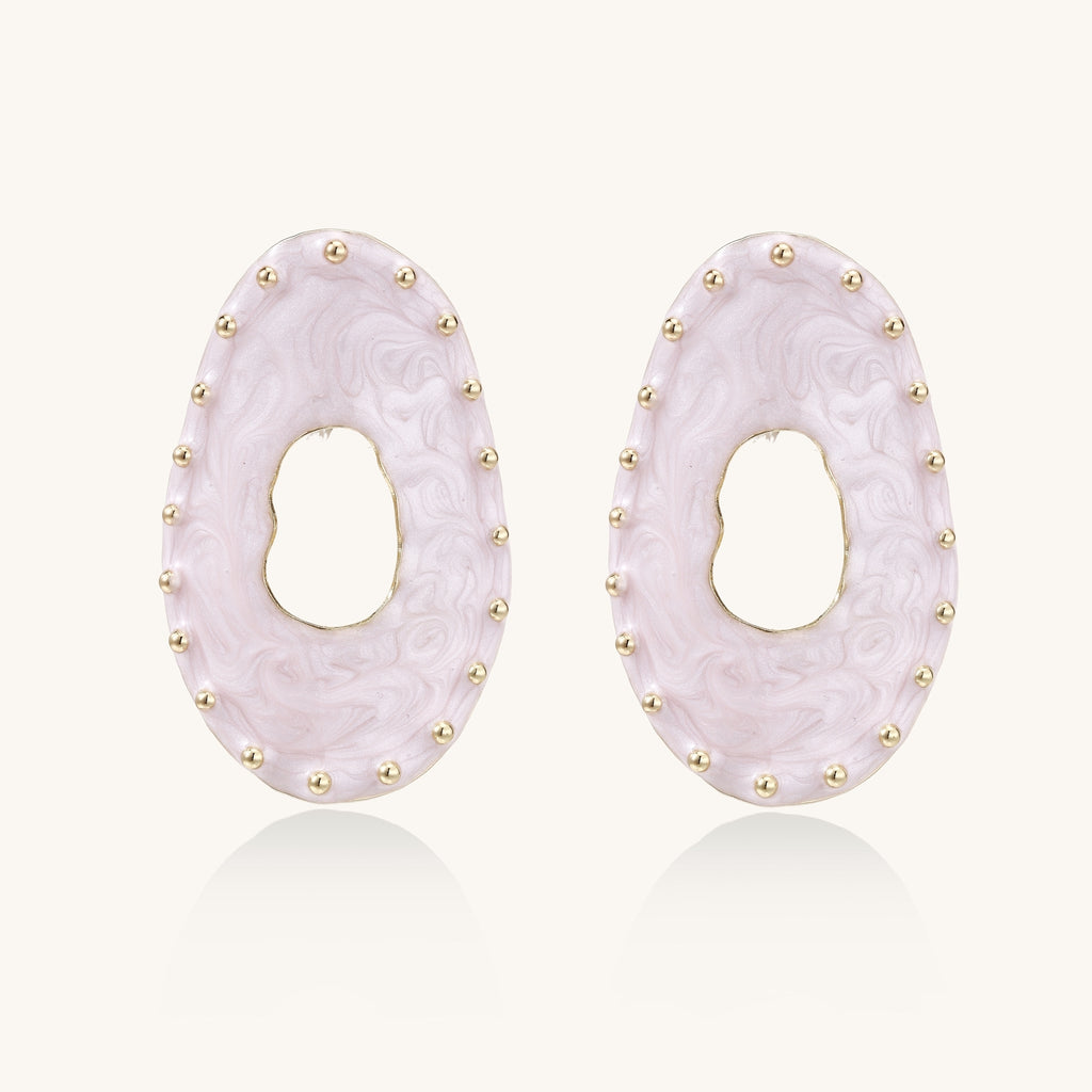 Oval lavender enamel earrings with gold studs around perimeter and cutout centers on white background