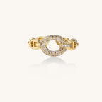 Gold-plated brass chain-link ring with cubic zirconia oval centerpiece, showing adjustable open-back design.