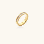 14K gold plated ring with channel-set zirconia stones and Greek key pattern engraved on sides on white background
